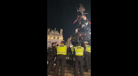 Police trying to get the freedom of Palestine Protesters off the Shaftesbury Memorial Fountain at Piccadilly Circus London