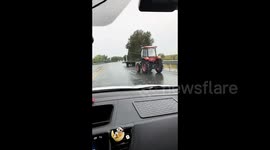 Driver races to reconnect runaway tractor trailer rolling down road in China