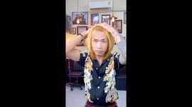 Dandy hairdresser shows off his impressive Beavis and Butt-Head blonde perm