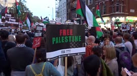 Pro-Palestine protesters chant Free Palestine outside the Israeli Embassy in London