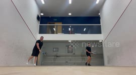 Squash player knocked out after furious opponent throws racket