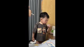 Brave boy battles bitter medicine with boost from parents' encouragement