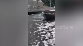 Ferrymen rescue local who fell into canal in Bangkok, Thailand