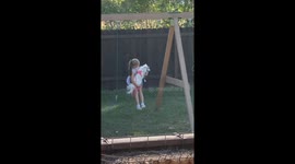 Girl and Dog Tumble Out of Swing Together