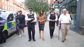 Suella Braverman walks along Golder Green Road after visiting the Community Security Trust in London, UK
