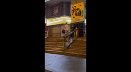 Skateboarding stunt gone wrong: young man hits rail and falls