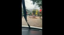 Man swept under car by raging floodwater in eastern Russia