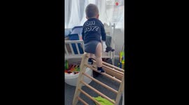 Go-getter baby boy puts Spy Kids to shame with his window board climbing adventure