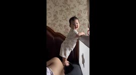 Baby's Wake-Up Call Service: Mischievous Toddler Bounces on Dad's Head in China