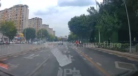 Grateful pedestrian doffs his cap for car stopping at crossing