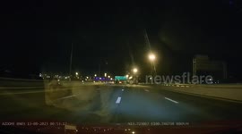 Car flies up central barrier on motorway in Thailand
