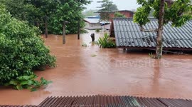 Flood reaches roofs as monsoon storms lash northern Thailand