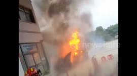 Quick-thinking Chinese staff extinguish blazing car after collision at petrol station