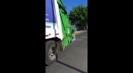 Garbage Man Rides Along on Toy Car