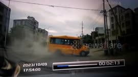 School bus and overloaded truck collide, leaving one dead in China