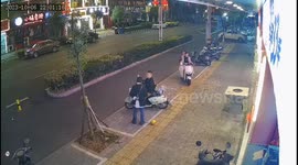 Quick-thinking father saves child from tumbling scooter in China