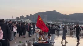 Chinese man dressed as anime character floats in sea