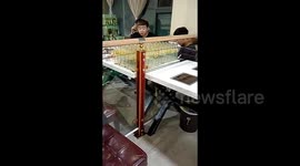Six young men astonish diners by downing more than 100 bottles of plum juice at Chinese hotpot buffet