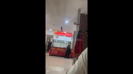 Student captures staged cafeteria mishap: singer's dance knocks waiter's cutlery