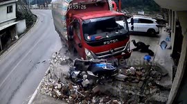 Out-of-control truck drags scooter rider along road after collision in China