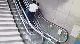 Chinese metro staff's heroic dash to save woman on brink of escalator fall