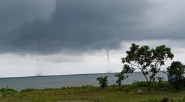 Twin waterspout tornadoes spotted off coastal town in the Philippines