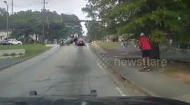 Moment cop saves elderly victim after SUV toppled onto side