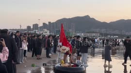 Chinese man dressed as anime character floats in sea