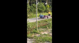 Two pet cats ride motorcycle by themselves