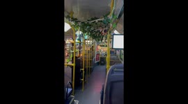 Bus adorned with hanging painted gourds in China