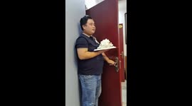 Friend's cake surprise backfires: hilarious moment caught on camera