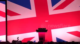 Starmer covered in glitter by protester as he begins conference speech in Liverpool, UK