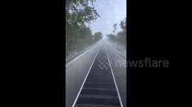 Tourist Showcases Ascending to Scenic Heights by Elevator in Zhejiang, China