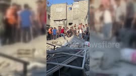 Palestinians Search Under Refugee Camp Rubble in Gaza, Palestine