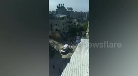 Injured Palestinian casualties evacuated from damaged house targeted in Gaza