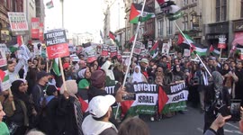 Thousands of Palestine supporters march down Whitehall during rally in London