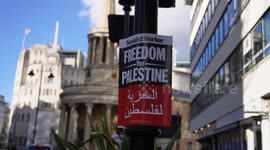 Cleaning crew start work at BBC HQ after Palestinian protests. Red Blood like paint sprayed on the building.