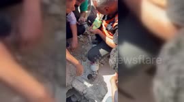 Palestinian Rescuers Battle To Free Raid Victim in Gaza, Plaestine