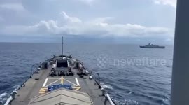 Philippine navy warns off Chinese vessel shadowing them near disputed islands