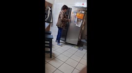 Mom chooses laughter over panic after son plays EVIL fridge prank on her