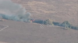 Ukrainian forces show burning remains of downed Russian Mi-8 helicopter