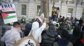 Pro-Palestinian protestors confront police arresting man at Gaza rally and try to stop van leaving