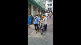 Playful Boys Showcase Skills in Sharing a Bike Riding in China