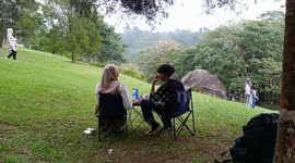 Child topples headfirst while running down grassy hill in Puncak, Indonesia