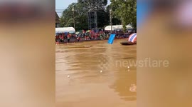 Oarsmen rescued when boat sinks in fast-flowing river during boat race in Thailand