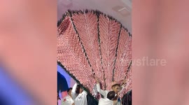 Thai singer receives costume made of thousands of bank notes from his fiancee