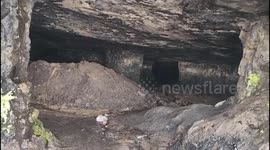 Two dead and more missing after cave collapse during illegal coal excavation in eastern India