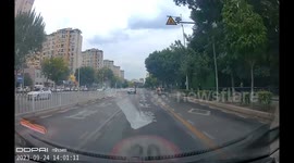 Chinese Elderly Man Tips Hat in Salute After Being Yielded by Driver in Liaoning, China