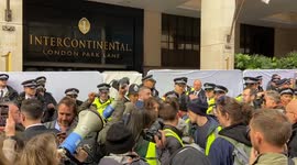 Police remove and arrest climate protesters during major oil summit in London