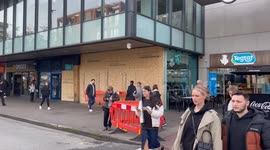 A woman has died after a bus crashed into a cafe in Manchester, injuring 11 other people